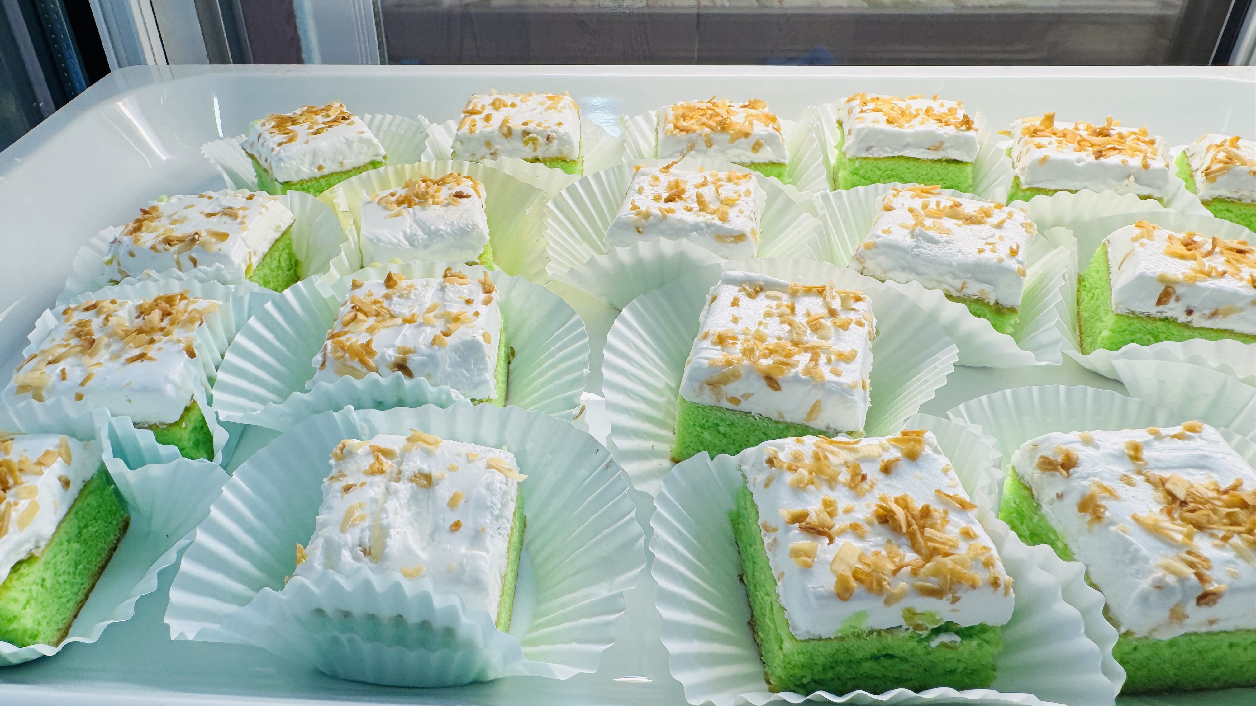 Coconut-topped green cake squares